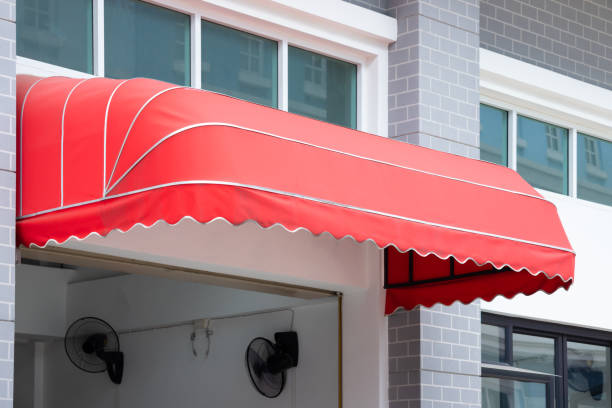 istock red awning. canvas shading over building entrance. 1098339088