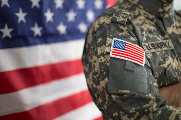 istock USA flag and US Army patch on solder's uniform 1098340842