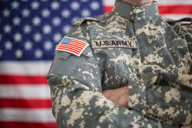 istock USA flag and US Army patch on solder's uniform 1098341056