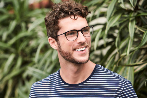Smiling guy in glasses stock photo