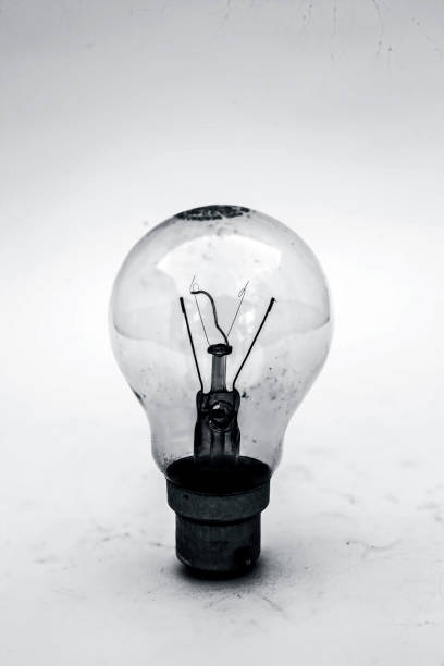 istock Close up of white colored bulb isolated on white. 1098345042
