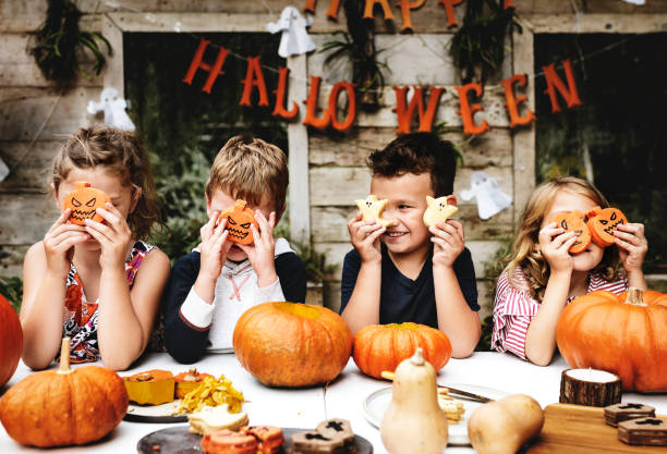 istock Little kids at Halloween party 1098347890