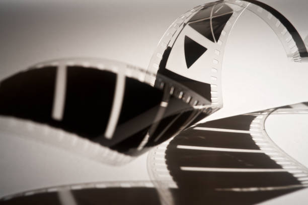 istock old 35mm film strip with shadow on white background 1098351902