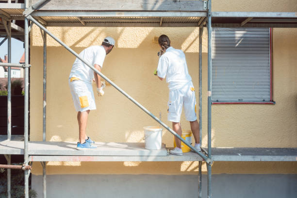 istock Back view of man and woman painter working 1098351926