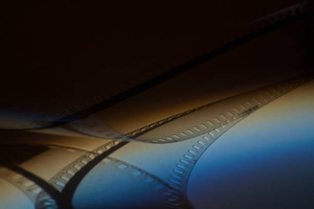 istock old 35mm film strip with blue shadow on dark background 1098351942