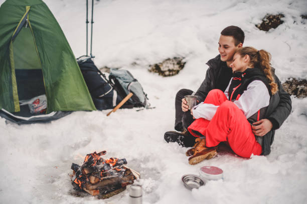 istock Couple in love at campfire 1098351980