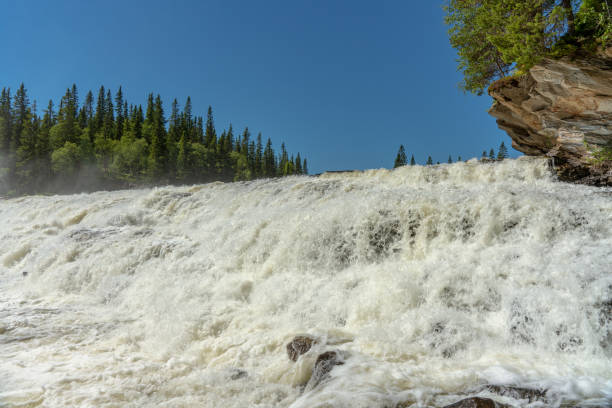 istock Close view of a waterfall with white flushing water 1098353356