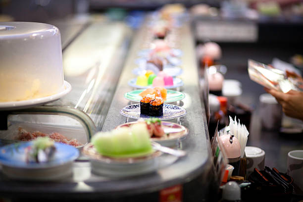 Sushi on a conveyer stock photo