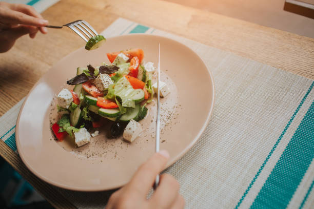 istock Woman, eating salad. Close up, top view 1098358430