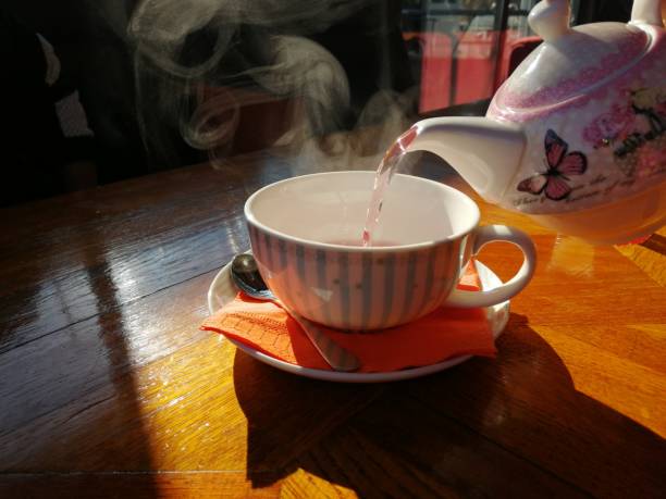 istock Cup of fruit tea with teapot 1098358590