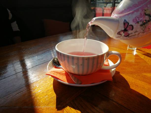 istock Cup of fruit tea with teapot 1098358614