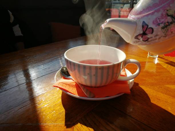 istock Cup of fruit tea with teapot 1098358652