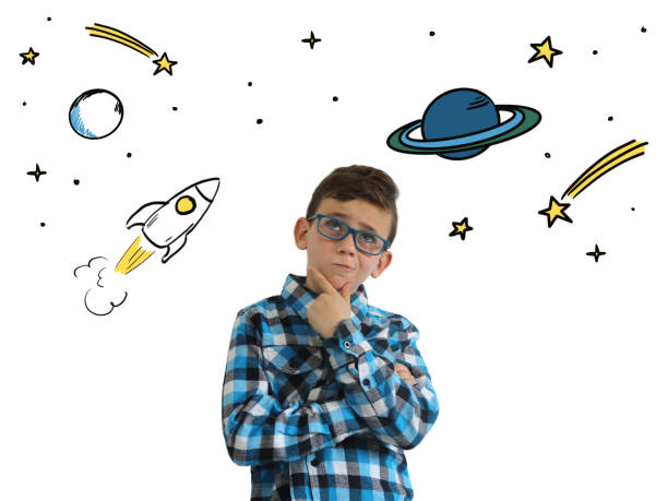 istock Young boy child think idea dreaming imagination space stars 1098359576