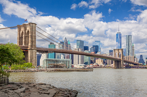 New York City Skyline with Brooklyn Bridge, Manhattan Lower East Side, World Trade Center, Beekman Tower (New York by Gehry), Woolworth Building, FDR Drive and East River, NY, USA.