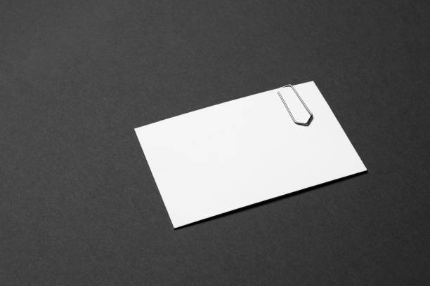 istock business card empty with paper clip on dark grey background 1098363996
