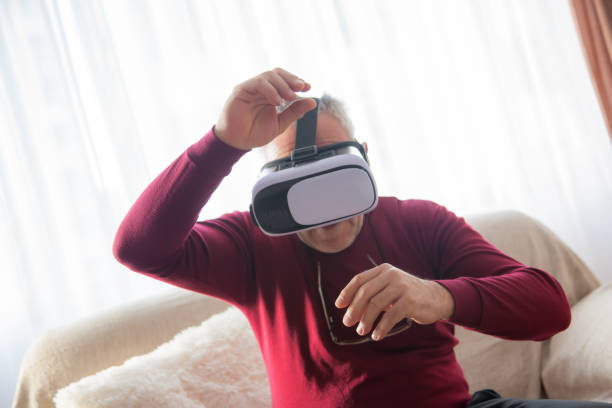 istock Senior man uses VR glasses 1098370774