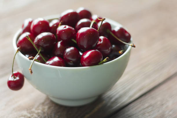 istock fresh cherries in a plate on a wooden background 1098370998