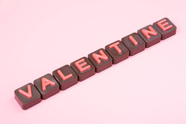 istock Valentine engraved in chocolate on colored background 1098372714