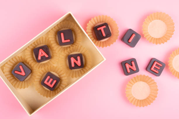 istock Valentine engraved in chocolate on colored background 1098373472