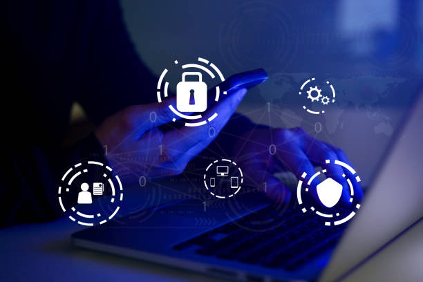 istock close up programmer man hold smartphone hand typing on keyboard laptop for register data system or access password and writing configuration for protection with virtual interface of cyber security at dark operation room , concept 1098374078