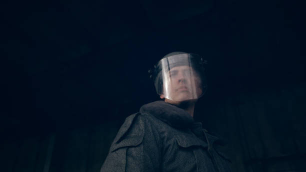 abandoned warehouse. Polish martial law 1981. Socialist militiaman on patrol Footage inspired by polish martial law 1981. Real costumes from the socialist era in Poland. riot police stock pictures, royalty-free photos & images