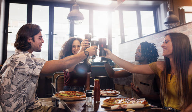 istock Diverse friends enjoying a meal together 1098380764