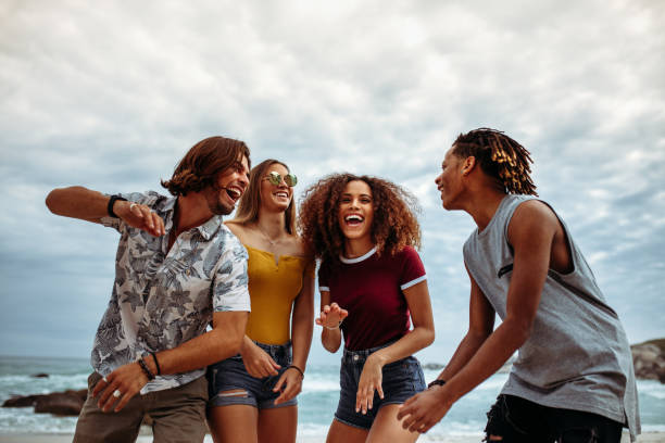 istock Group of multi-ethnic friends enjoying on the beach 1098380936