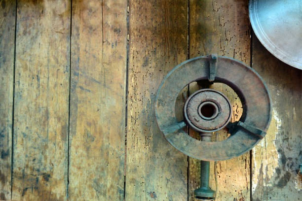 istock the old iron gas stove  with pan on wooden table 1098381996