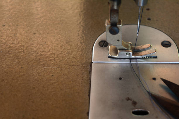 istock the old scissor ,blue thread in presser foot on panel of old sewing machine 1098382162