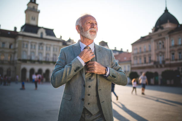 istock Cheerful businessman on a town square 1098387630