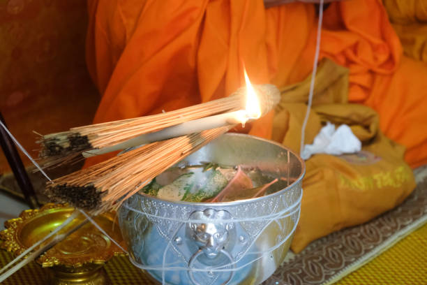 istock Monk is burning candles to make holy water. Thailand 1098387772