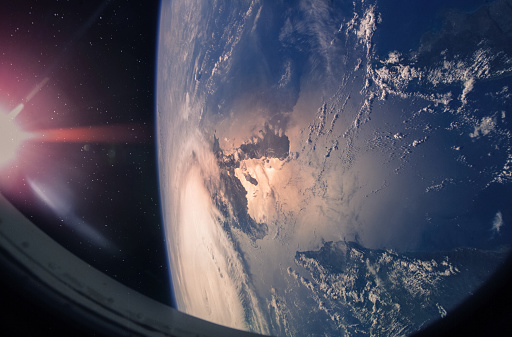 Planet Earth and hurricane from the outer space from the ISS window. Elements of this image furnished by NASA.