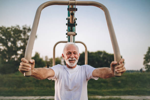 istock Young at heart senior man exercising in a park 1098391314