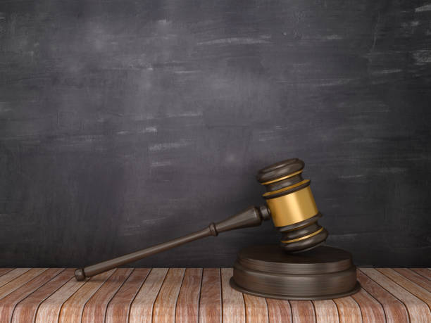 istock Gavel on Wood Floor - Chalkboard Background - 3D Rendering 1098396378