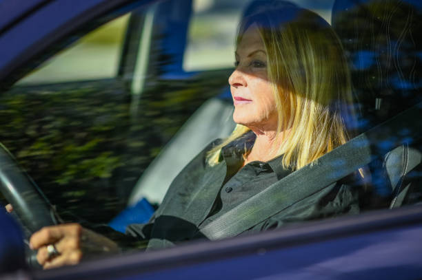 istock Beautiful blonde female driver, 60 years old 1098397912