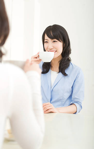 istock Young Asian Woman at a Cafe 109839816