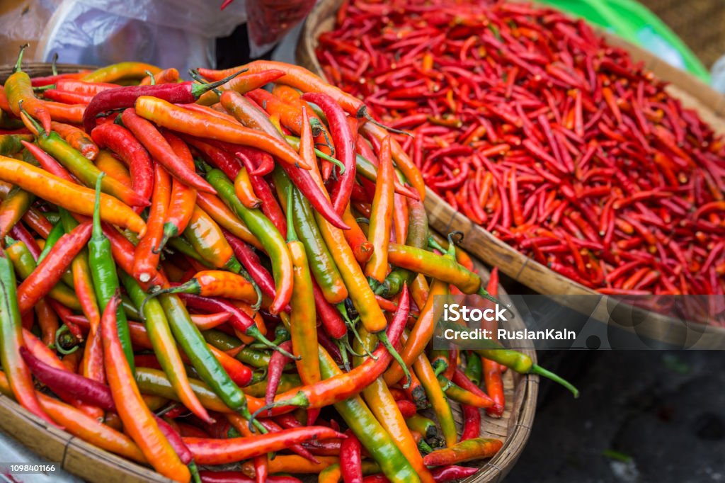 Exotic seafood, fruit and vegetable delicacy at the local market in Thailand Hot chili peppers on the exotic thai market at sunny day Business Stock Photo
