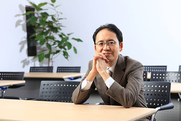 Asian Business Man Portrait Relaxed Pose stock photo