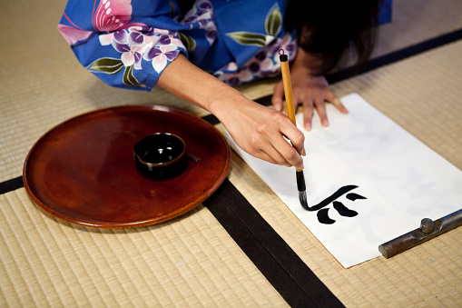 Beautiful Japanese geisha a calligraphic type.