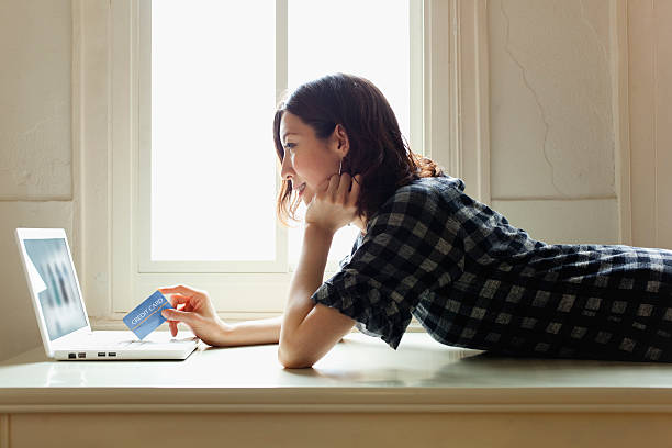 Woman doing online shopping stock photo