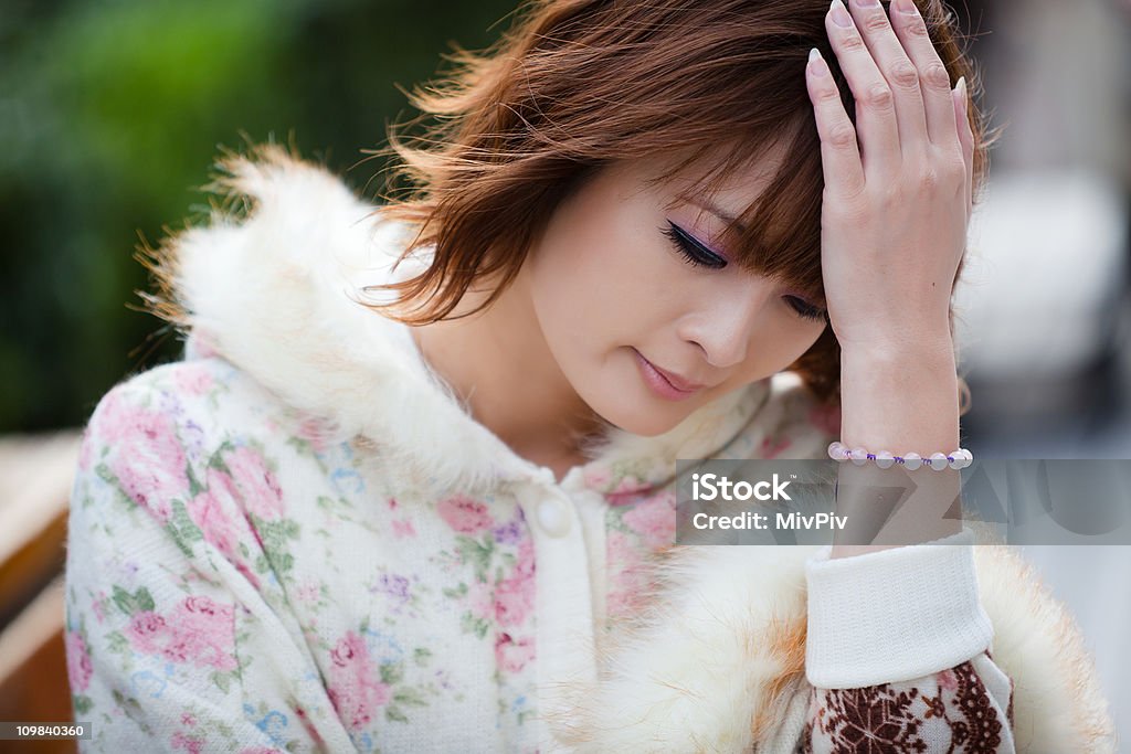 Japanische Frau mit einem Kopfschmerz - Lizenzfrei Asiatischer und Indischer Abstammung Stock-Foto