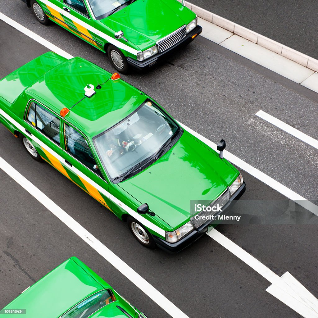Tokyo Taxis Japan Typical green colored taxis - cabs from above in the streets of downtown tokyo. Tokyo City, Japan. Squared. Taxi Stock Photo