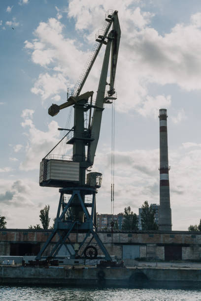 istock Portal crane on river bank against sky 1098406870