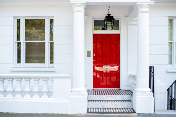 Beautiful red door in a white house facade in Notting Hill Beautiful red door in a white house facade in Notting Hill borough district type photos stock pictures, royalty-free photos & images