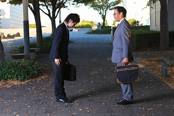 istock Japanese business men - bowing to say goodbye 109841504