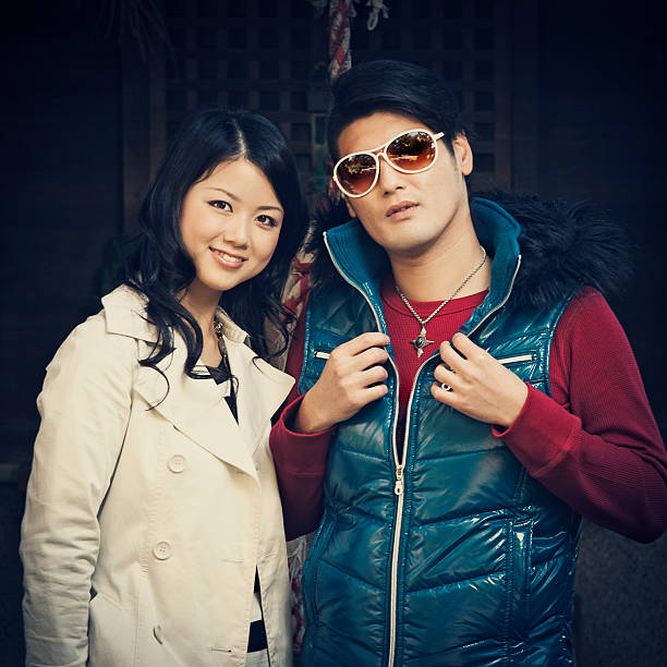 istock young japanese couple posing 109841688