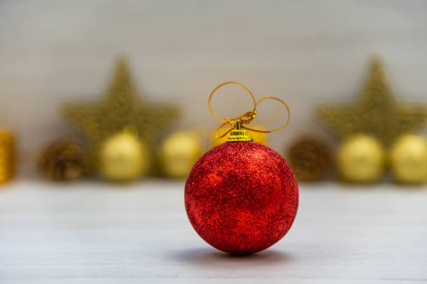 istock Christmas ornaments on white wood table, selective focus. 1098421094