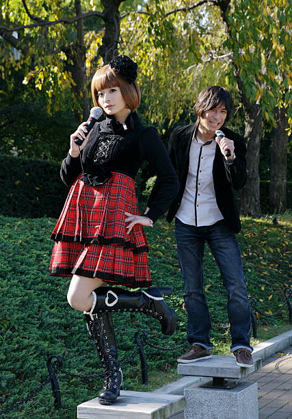 istock Young couple singing in the park. 109842150