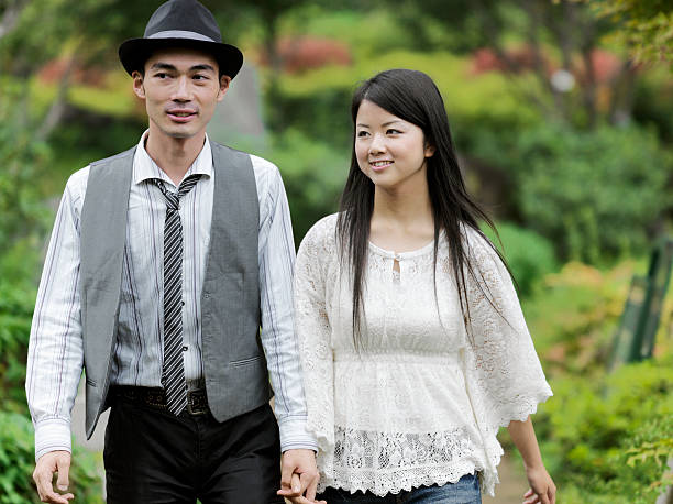 istock Young Couple Walking through the Park 109842299