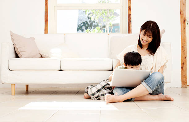 istock Mother and son with laptop 109842376